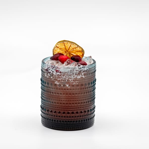 Lomeli's Mexican Bar and Grill's cocktail with cranberries, dried orange, and a salted rim.
